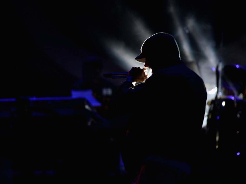 A man sitting in a dark room